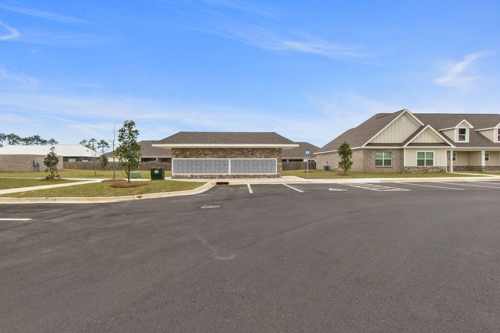 an empty parking lot in front of a house
