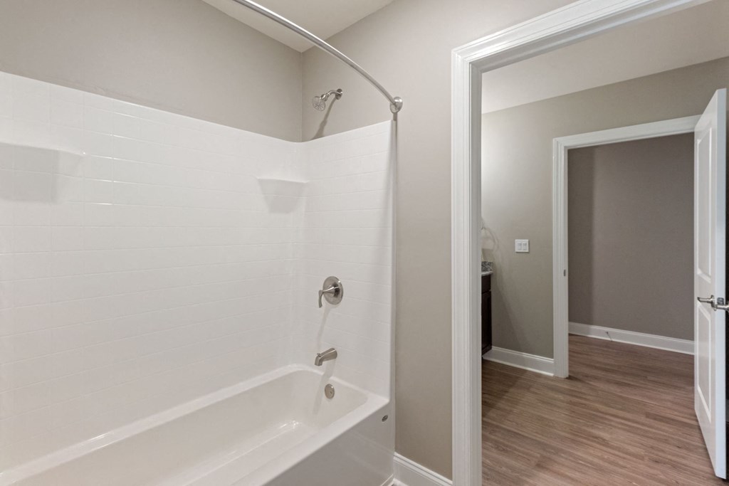 the preserve at ballantyne commons apartment bathroom with tub and walk in shower