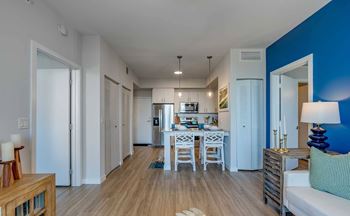 A modern kitchen with a dining table and chairs.