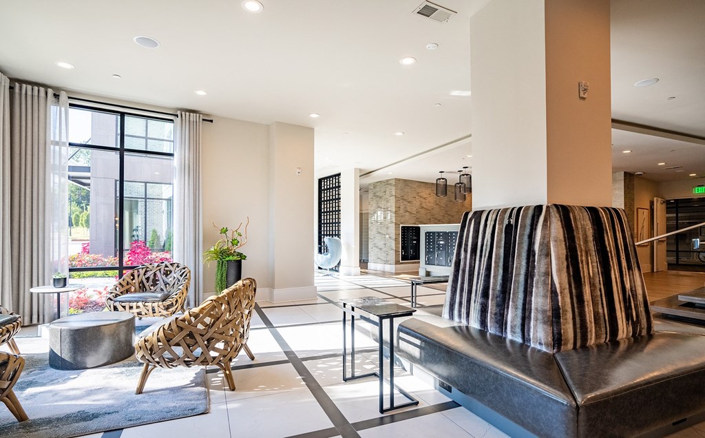 a living room with a couch and chairs and a fireplace