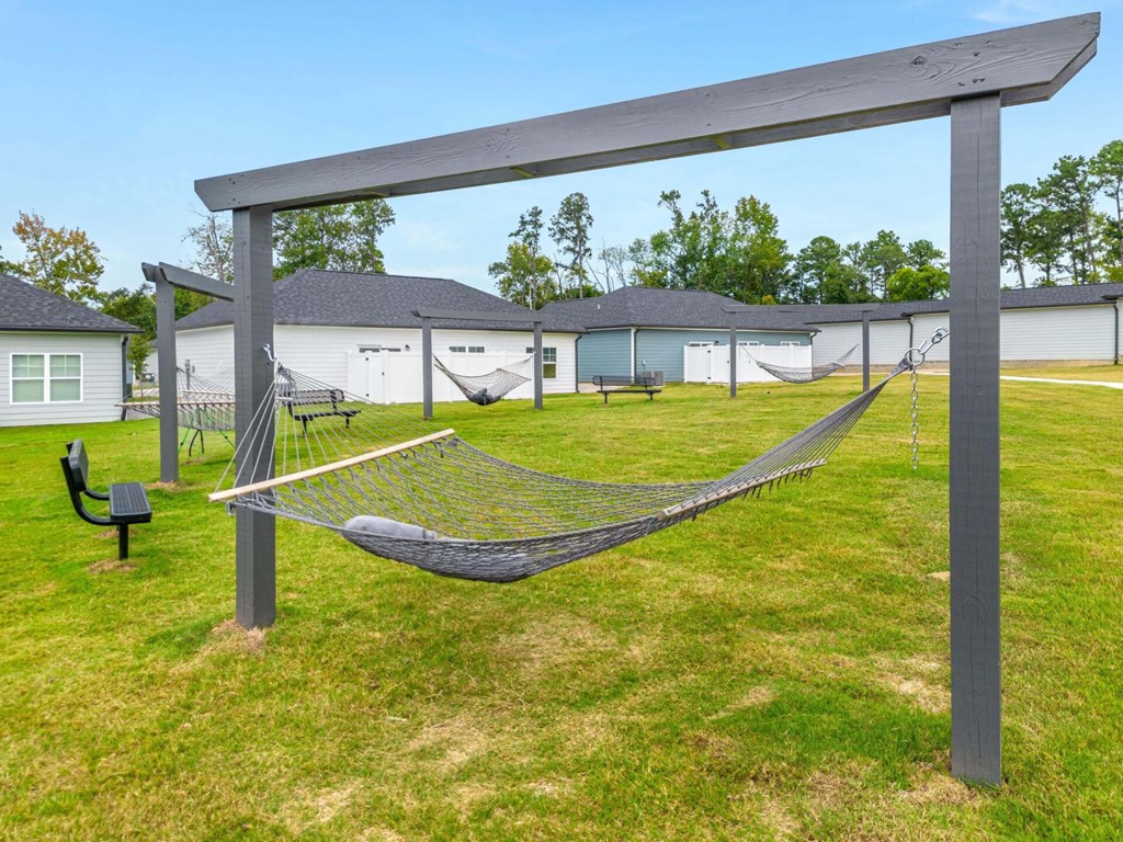a hammock in the yard of a home