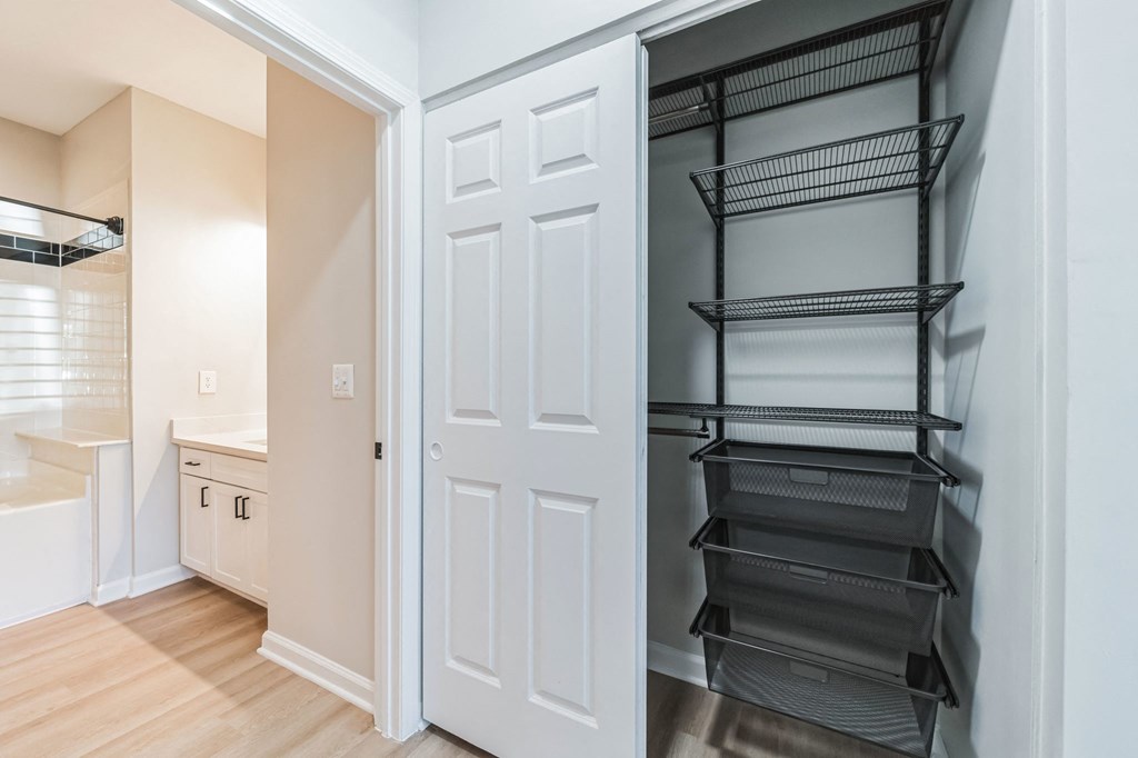 an empty closet in a home with an open door
