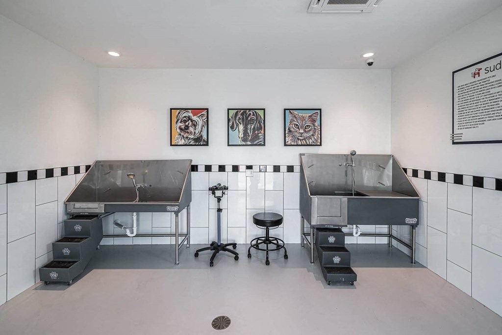 a kitchen with two stainless steel sinks in a room at Altis Blue Lake, Lake Worth, 33467