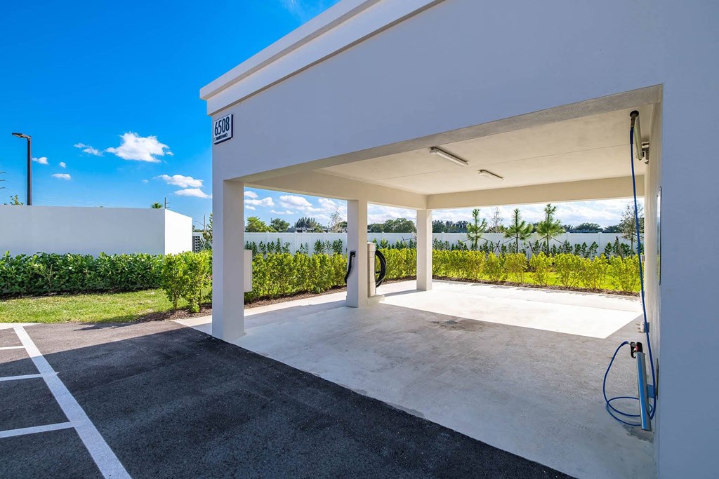 the garage of a house with a view of the water at Altis Blue Lake, Lake Worth, Florida