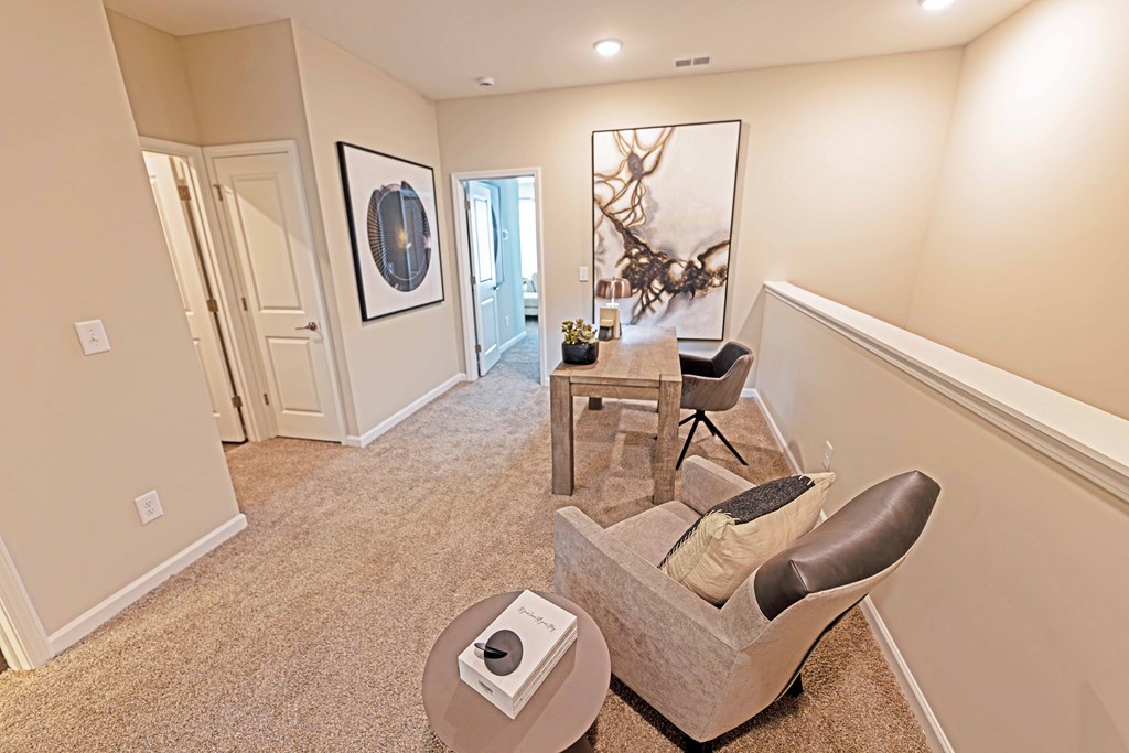 a living room with a chair and table