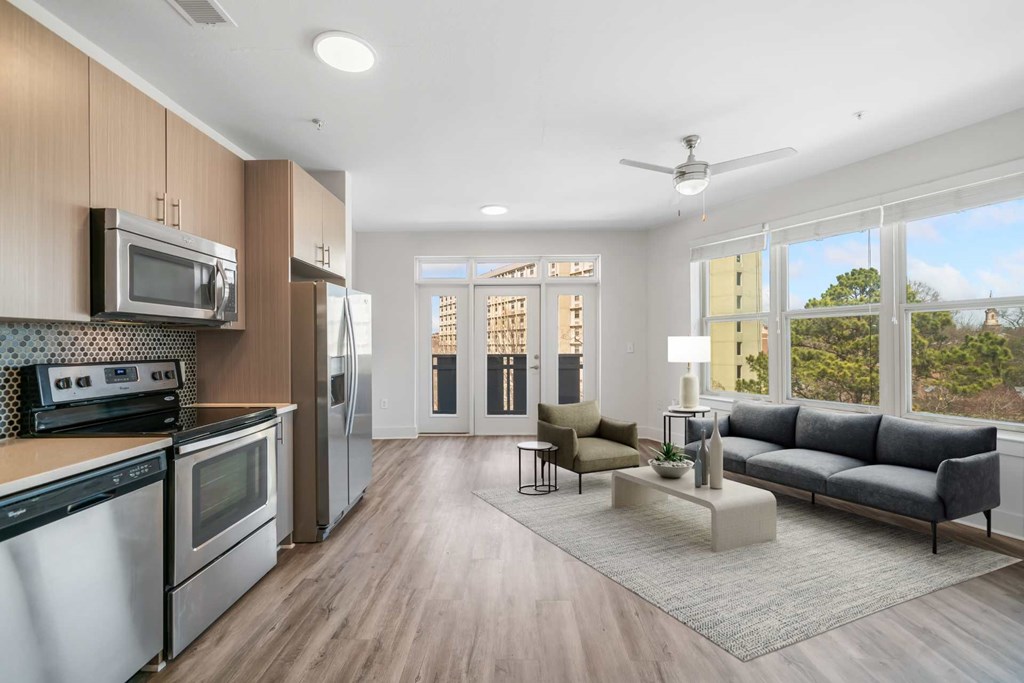 A modern kitchen with wooden cabinets and stainless steel appliances.