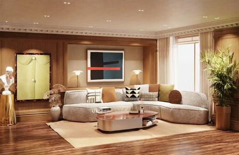A living room with a grey sofa, a coffee table, and a painting on the wall.