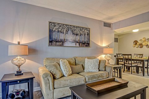 a living room with a couch and a table