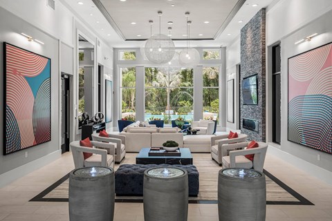 A modern living room with a large painting on the wall.