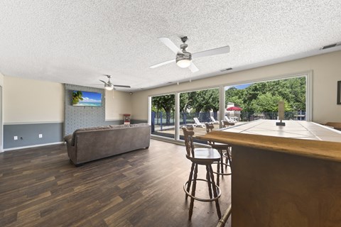 the preserve at ballantyne commons clubhouse with bar and living room