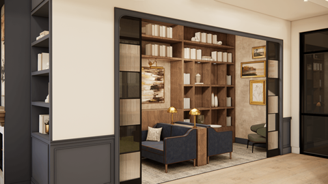 A living room with a dark blue couch and a bookshelf filled with books.