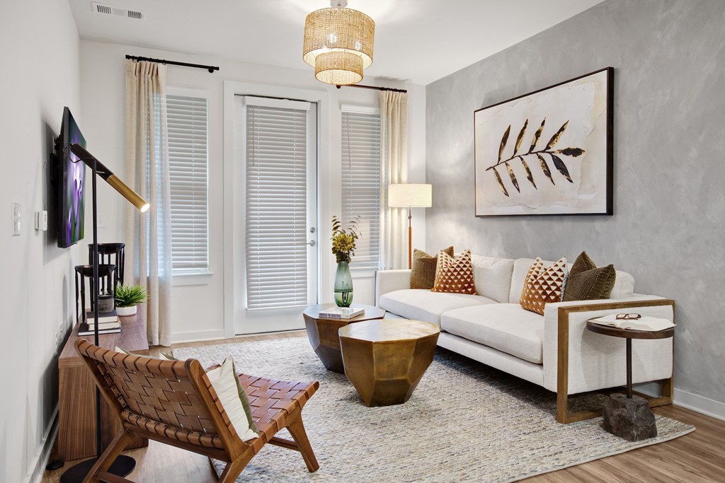 a living room with a couch chair and coffee table