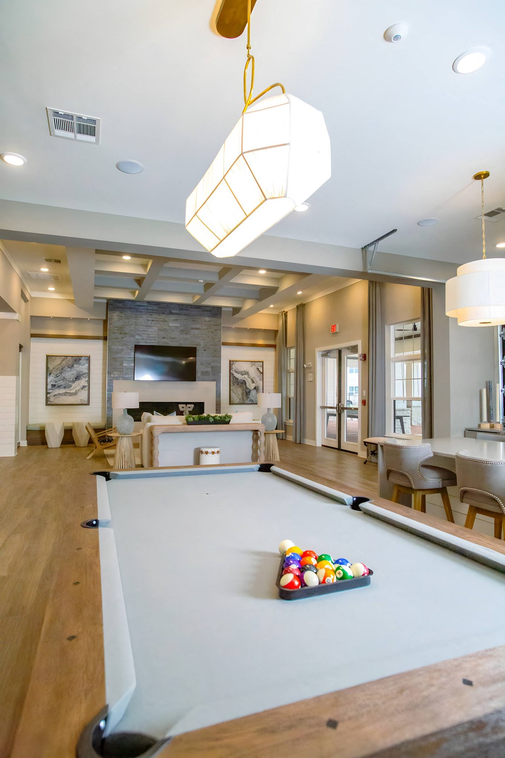 a pool table in the center of a living room
