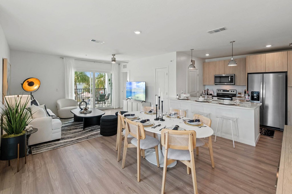a kitchen and dining room with a table and chairs