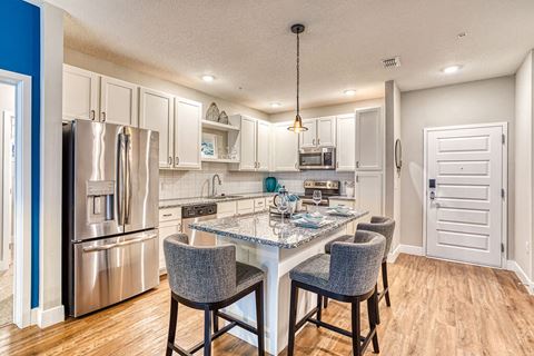 Fitted Kitchen With Island Dining at The Parker at Maitland Station, Florida