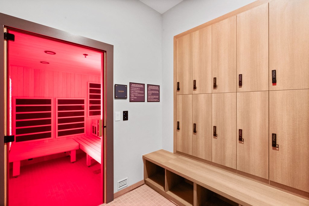 A room with a bench and lockers.