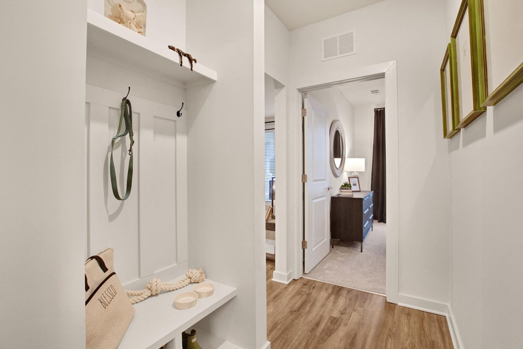 a walk in closet and bathroom in a 555 waverly unit