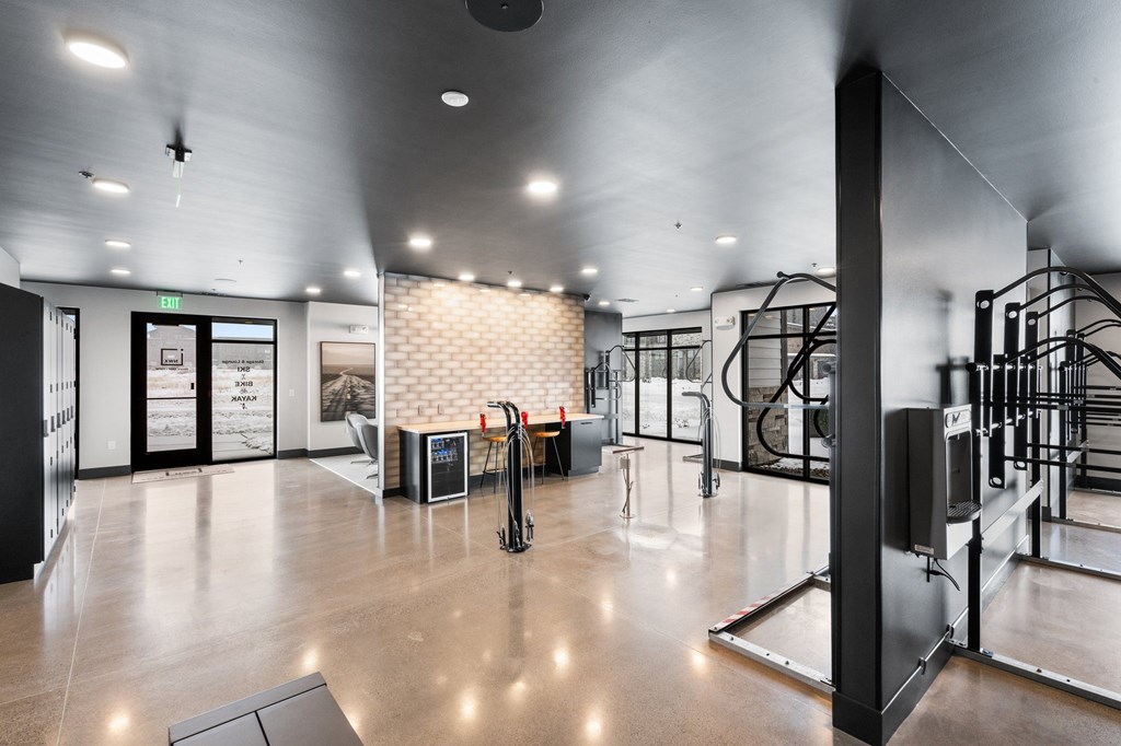 A modern gym with a variety of equipment.