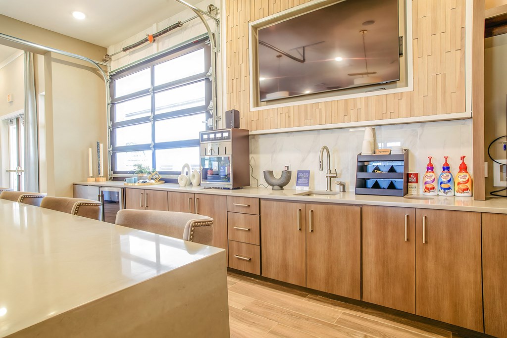 a kitchen with wooden cabinets and a counter top and a window