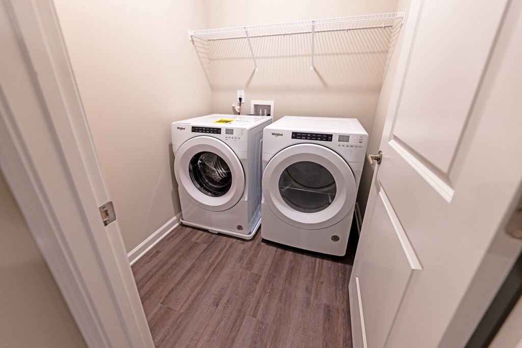 a small laundry room with a washer and dryer