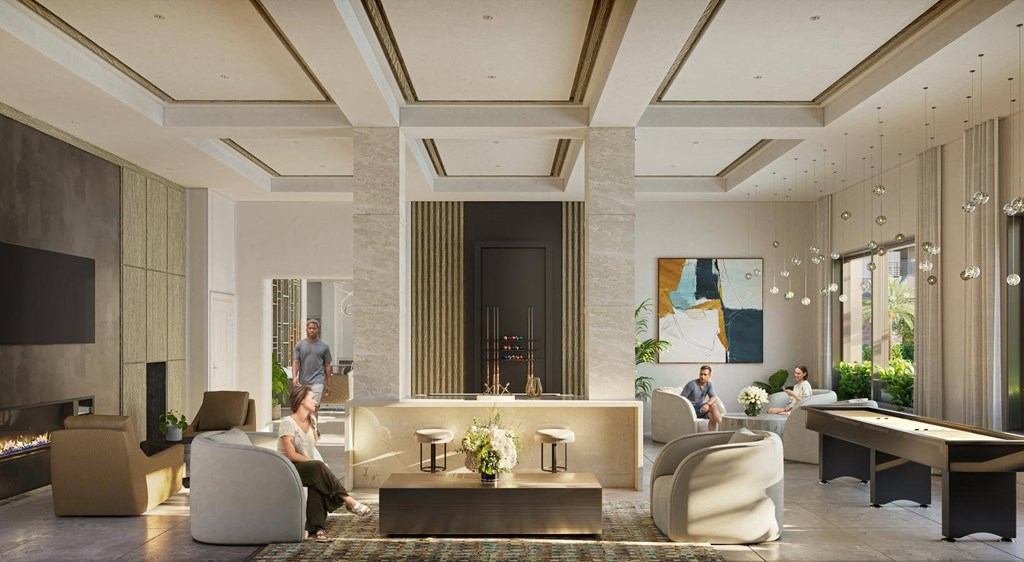 A modern living room with a fireplace and people sitting on the couch.