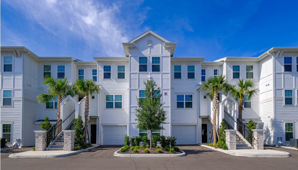 a building with palm trees in front of it