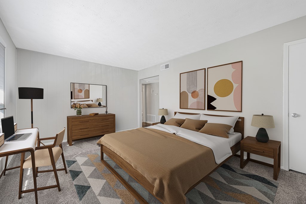 a bedroom with a bed and a desk with a chair