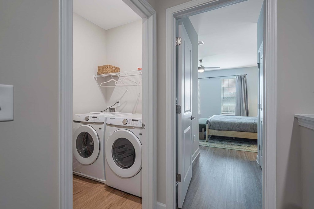 A laundry room with a washer and dryer in it.