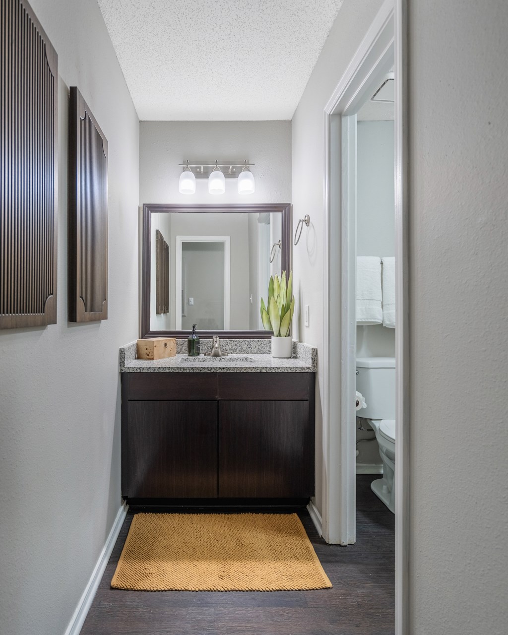 A bathroom with a sink and mirror.