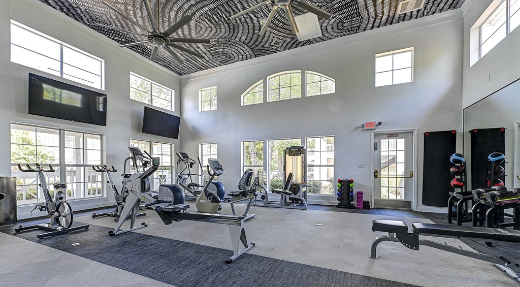a gym with treadmills and other exercise equipment