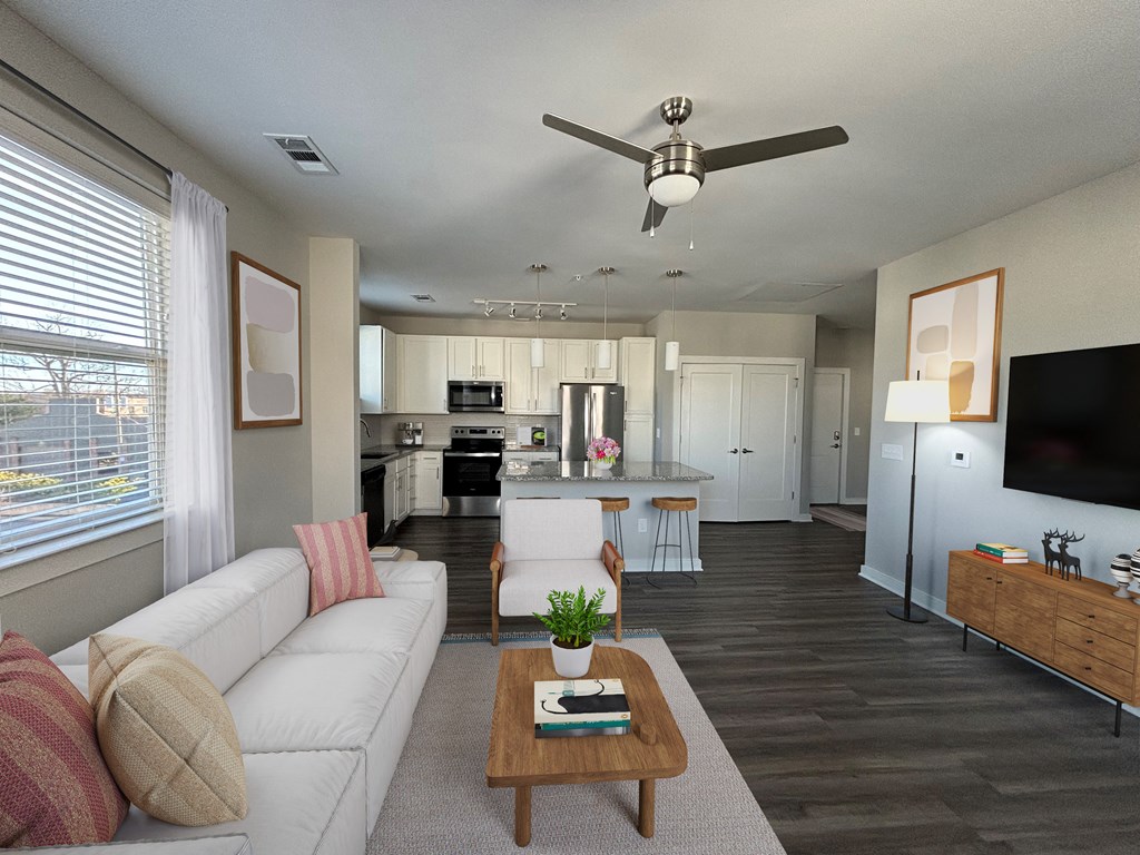 A modern living room with a white couch and a wooden coffee table.