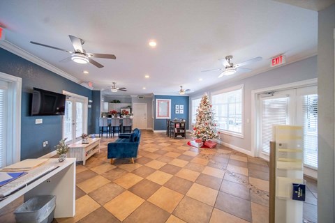 A living room with a Christmas tree and a checkered floor.