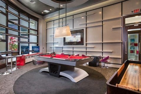 a pool table is in the middle of a room at Altis Kendall Square, Miami Florida