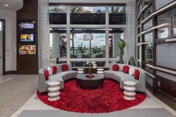 a living room filled with furniture and a large window - Photo Gallery 14