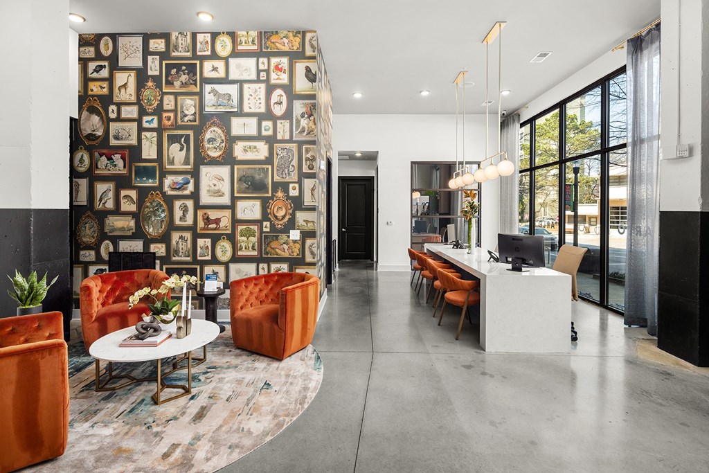a living room with a wall covered in diplomas