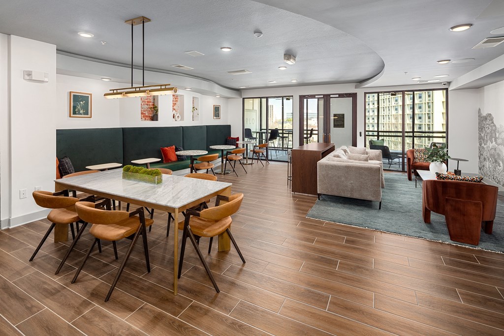 a dining room and living room with a table and chairs