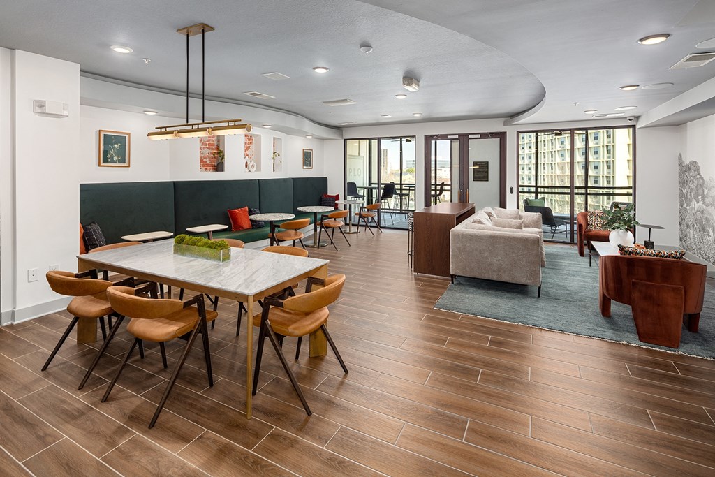 a dining room and living room with a table and chairs