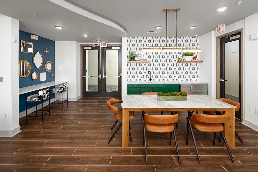 a dining room with a table and chairs