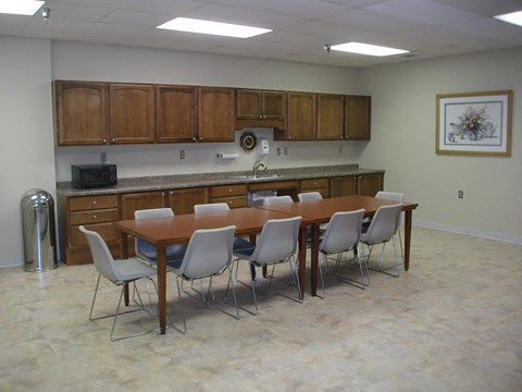 a dining room with a table and chairs