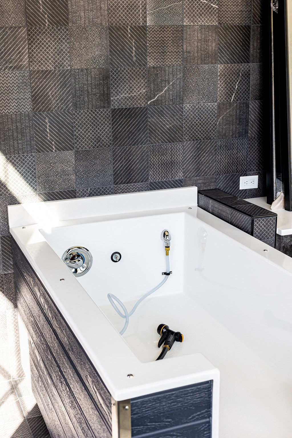 a bathroom with a bath tub and a sink and a mirror