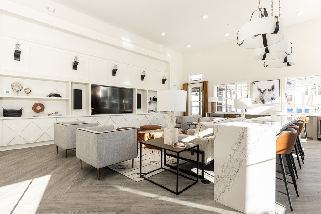 a living room with a kitchen and a dining room