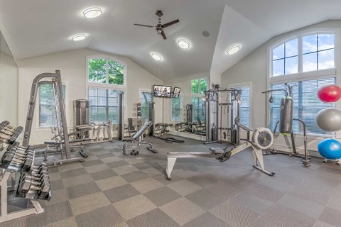 Charlotte, NC, Apartments Near Charlotte Premium Outlets - Gramercy Square at Ayrsley - Fitness Center With Strength Machines, Free Weights, Cardio Equipment, Arched Windows, And Rubber Flooring.