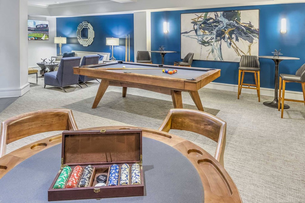 A pool table with a billiard set on it.