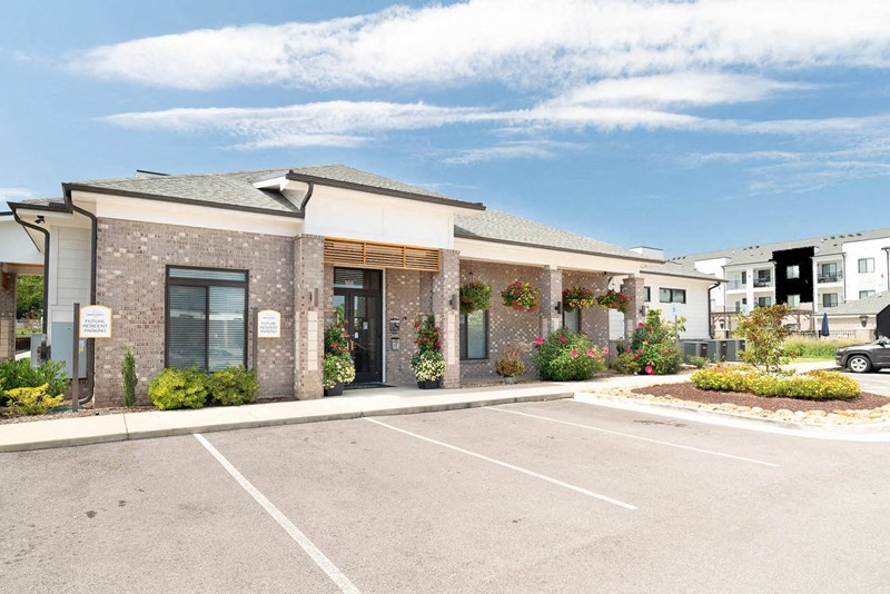 an empty parking lot in front of a building