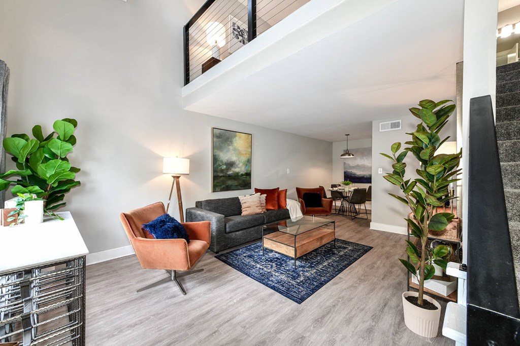 a living room with a couch and a chair  at District at Vinings, Georgia