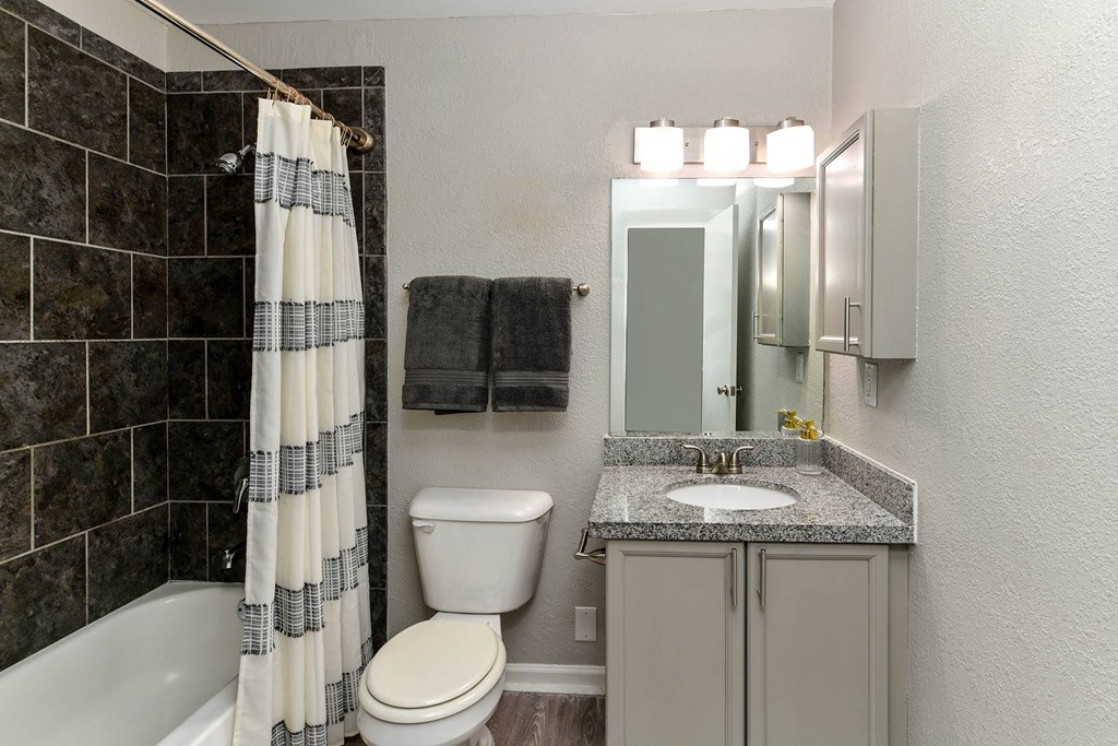 our apartments have a bathroom with a bathtub  at District at Vinings, Atlanta, Georgia