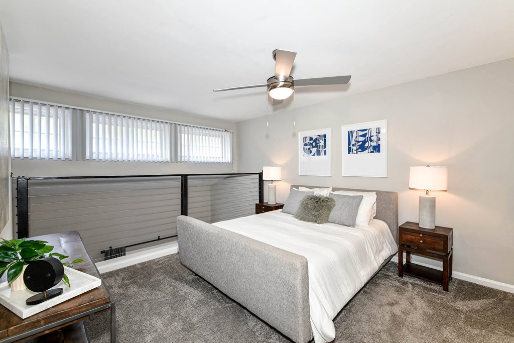 a bedroom with a bed and a ceiling fan  at District at Vinings, Atlanta, GA, 30339