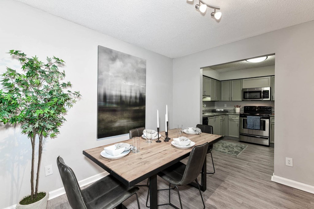 a dining room with a table and chairs  at District at Vinings, Atlanta
