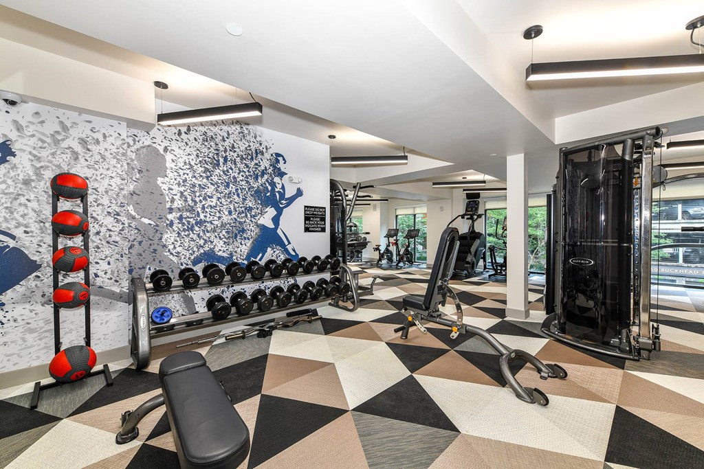a home gym with a black and white checkered floor