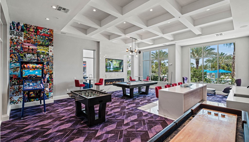 a living room filled with furniture and a large window